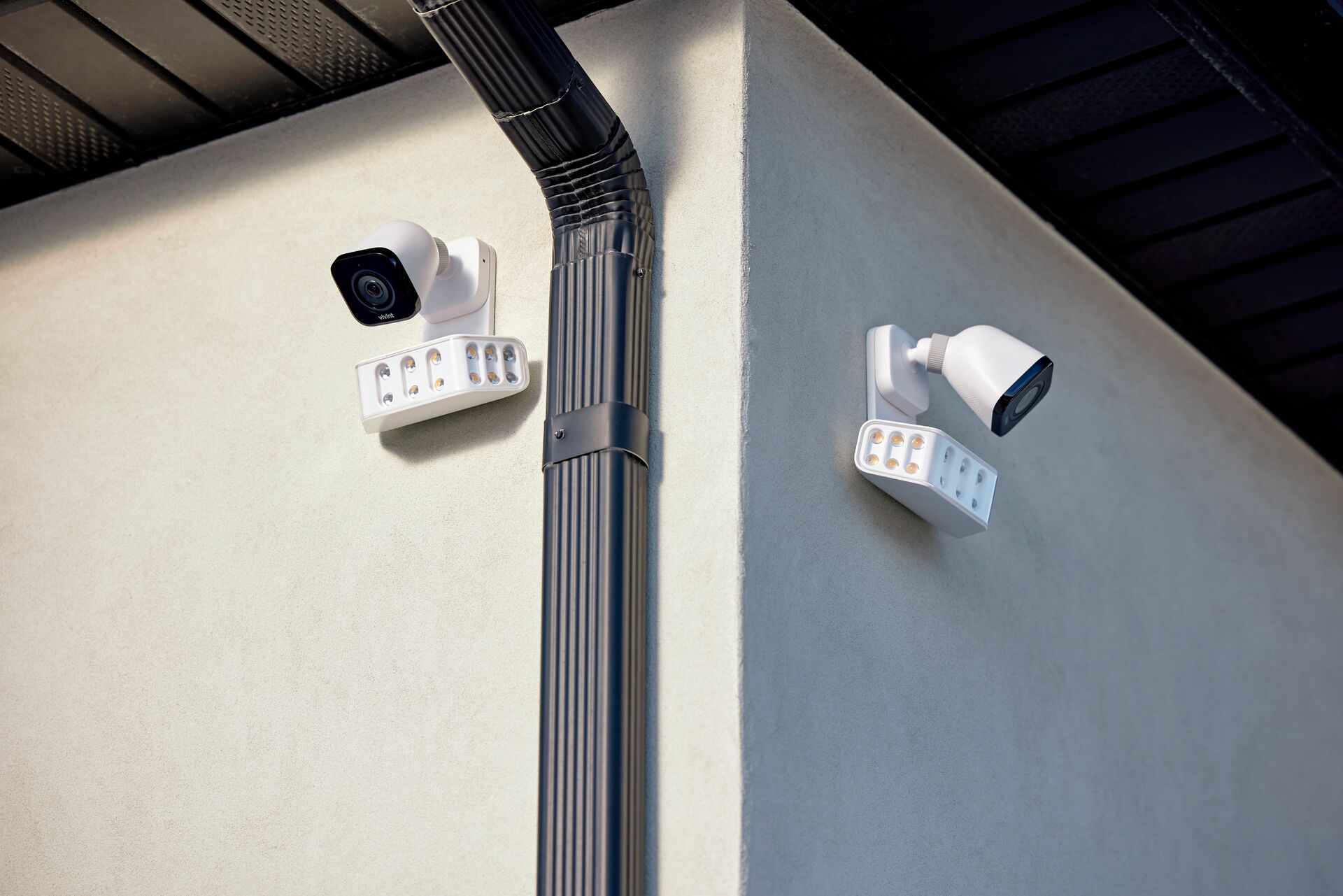 Dual-angle exterior security camera installation matrix covering wide residential perimeter